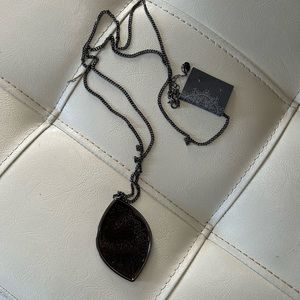 Howard’s 18’/20’ long black necklace with pendant